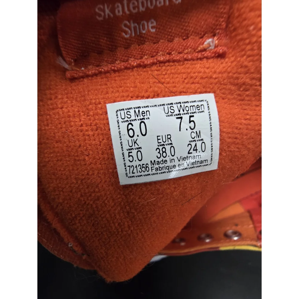 Vans Sk8-Hi high-top sneakers in an orange and yellow camouflage